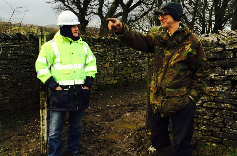 Fell End Broadband. Parish council chairman Ernest Leach talking to fibre planner Trevor Lawton