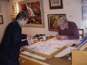 David and Caroline work on the map